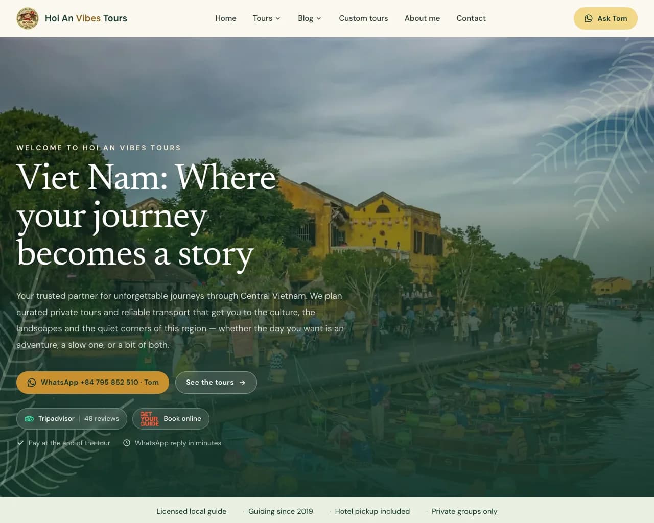 Hoi An Vibes Tours' live homepage hero — Hoi An's lantern-lit riverfront at dusk under the headline 'Viet Nam: Where your journey becomes a story'